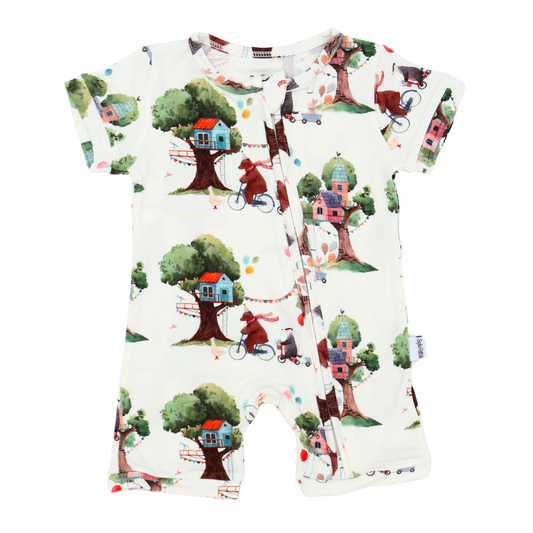 Baby romper with treehouse and bicycle pattern on a white background