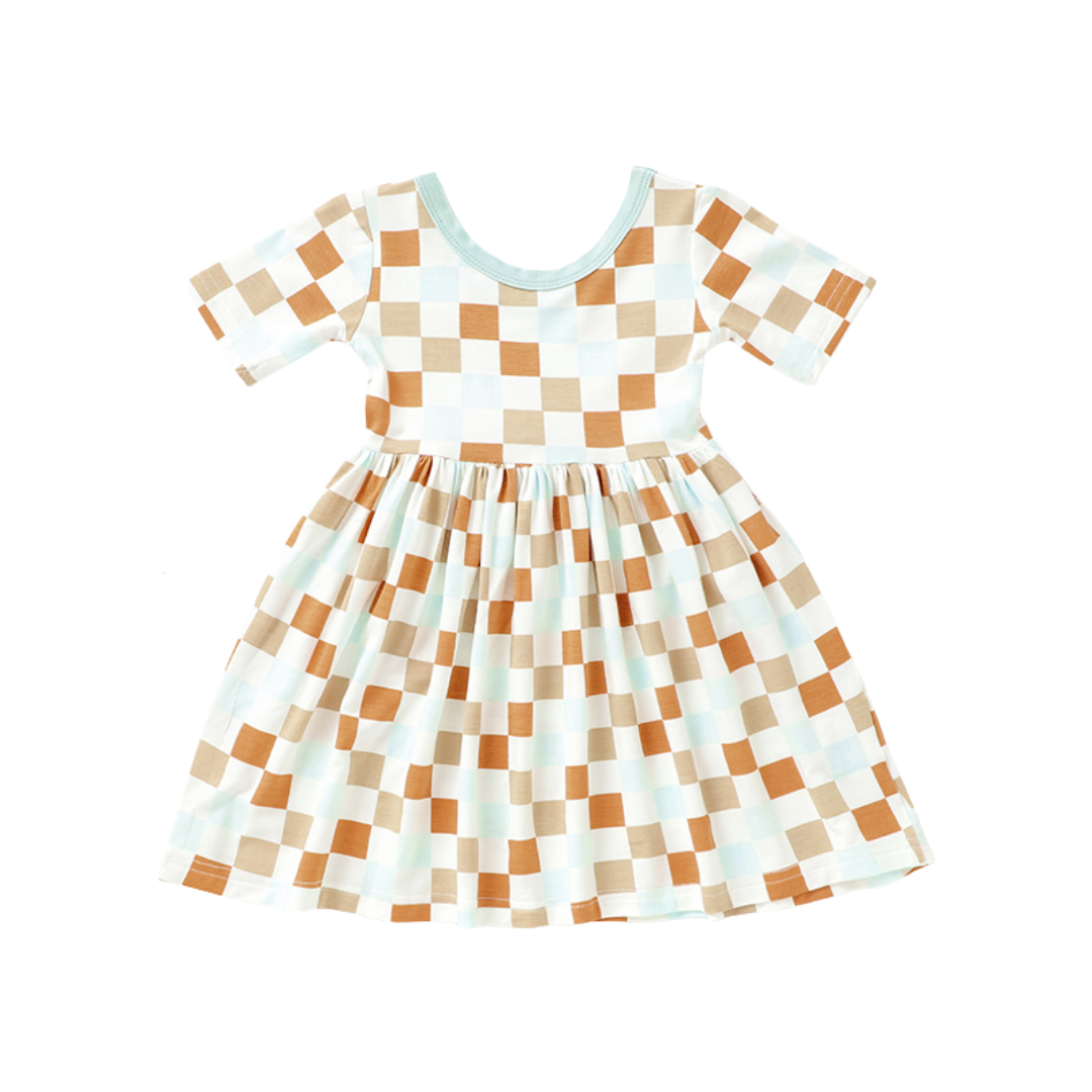 Checkered dress with brown and white pattern on a white background