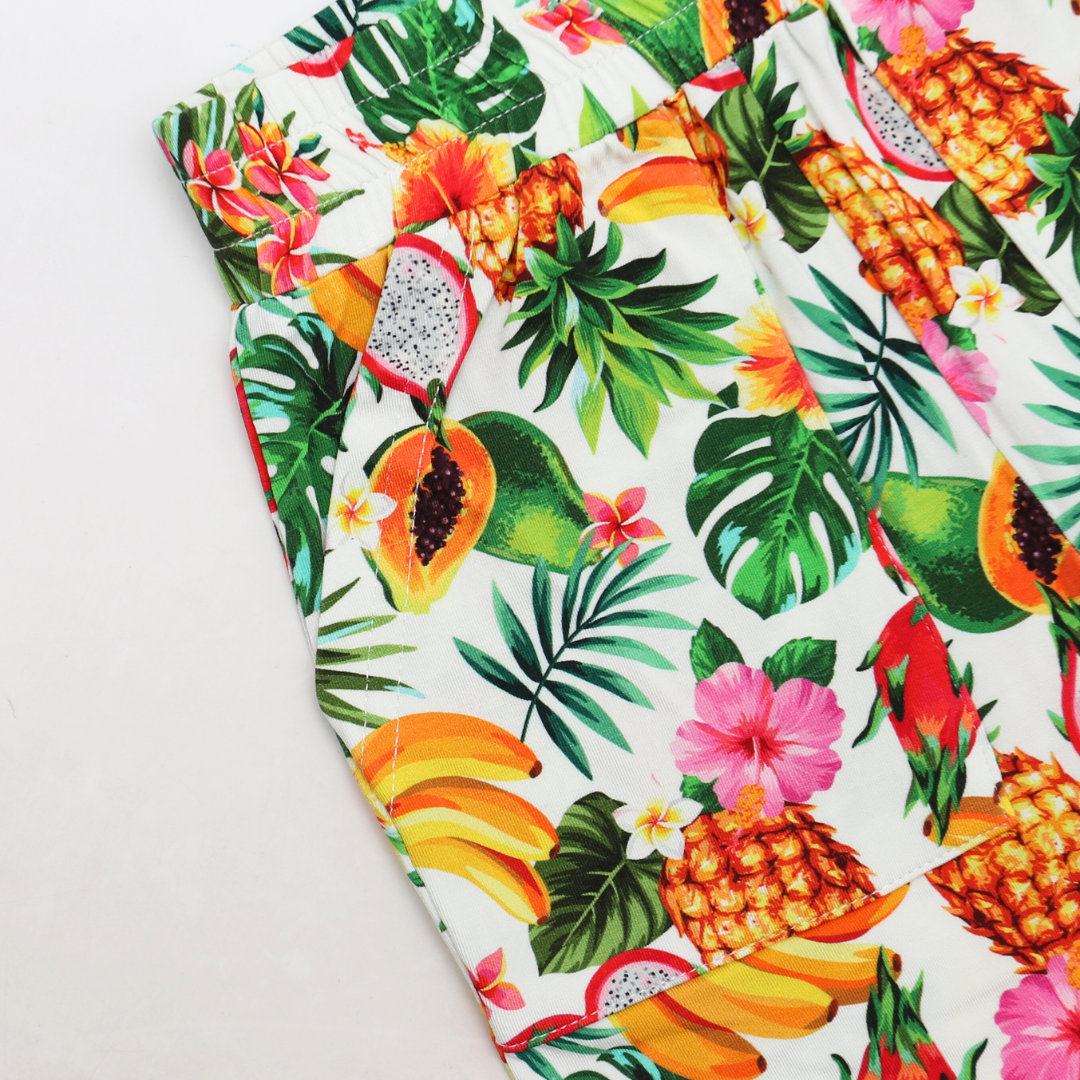 Fabric with tropical fruit and leaf pattern on a white background